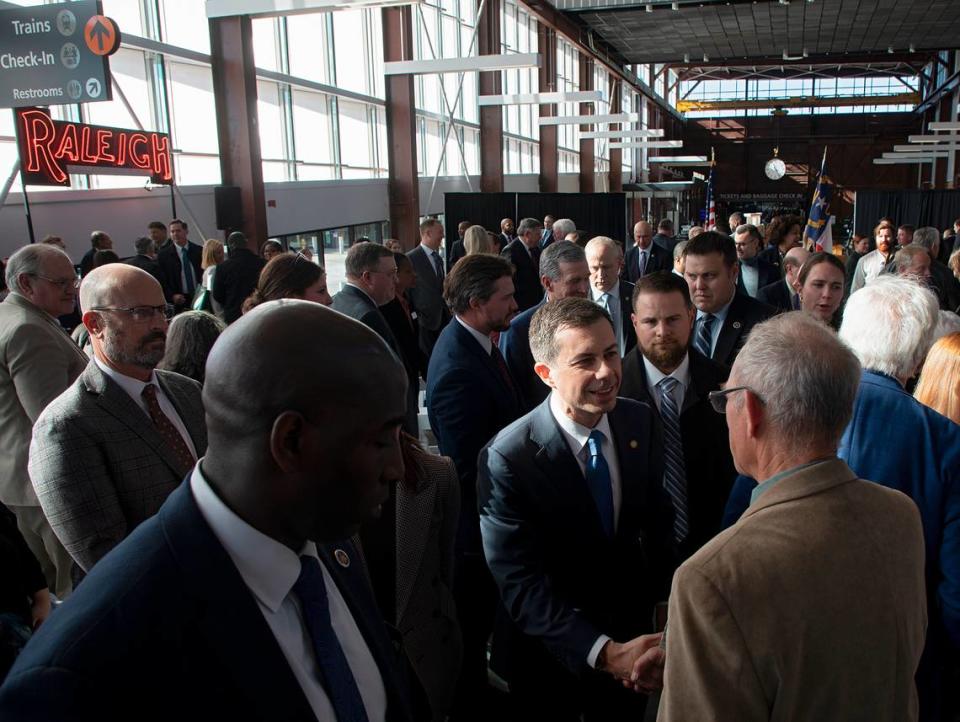 U.S. Transportation Secretary Pete Buttigieg greets guests following an event at Raleigh Union Station on Monday, Dec. 11, 2023, to celebrate construction of the first leg of a high-speed rail line between the Triangle and Richmond, Va.
