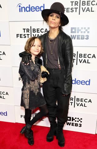 <p>Theo Wargo/Getty</p> Linda Perry and her child Rhodes in June 2024.