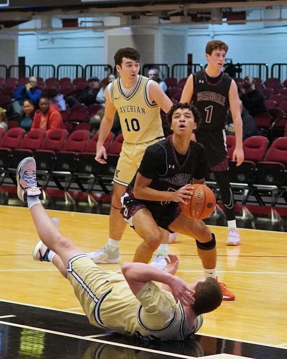 Scarsdale's Brandon Gibbons draw contact during the first half of the Raiders' 61-37 loss to Xaverian in the Public vs. Catholic Hoops Showdown at the Westchester County Center on Saturday, Feb. 3, 2024. The junior point guard finished with 14 points.