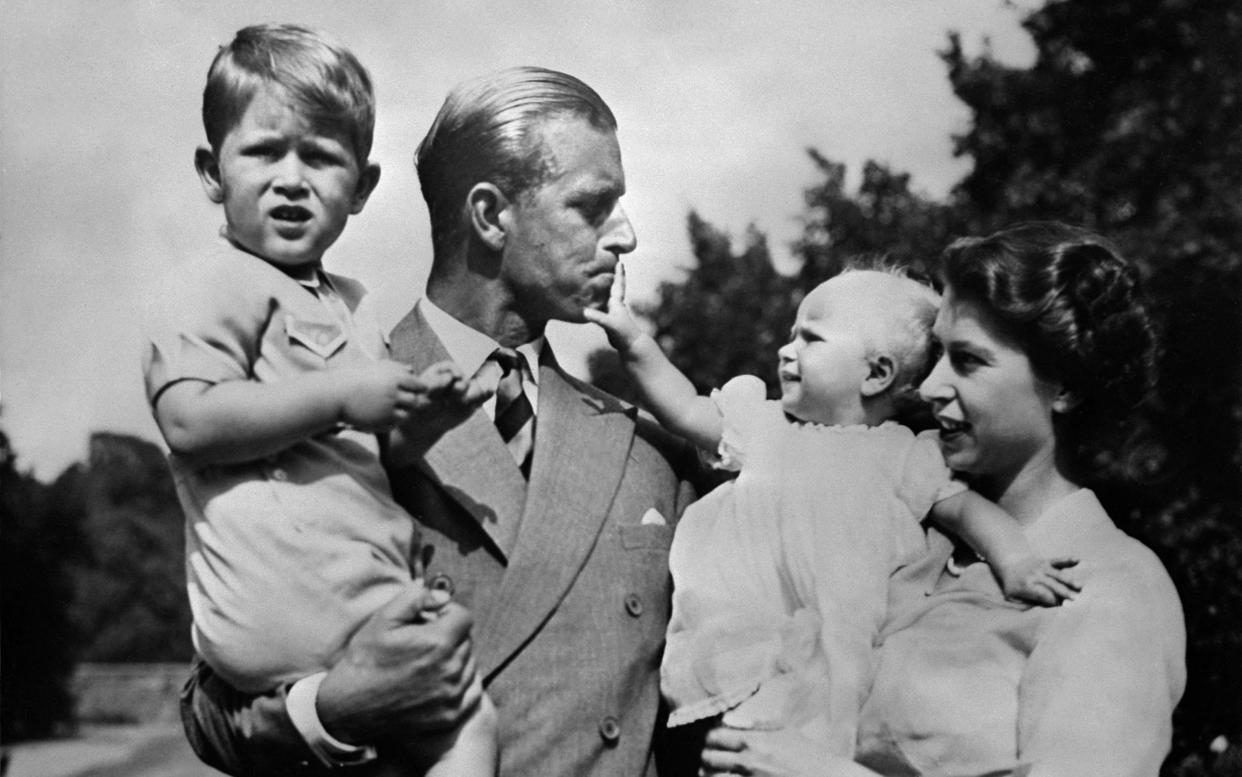 An undated photograph showing Queen Elizabeth II, and her husband Prince Philip, Duke of Edinburgh, with, Charles, Prince of Wales (L) and Princess Anne (R) - AFP via Getty Images