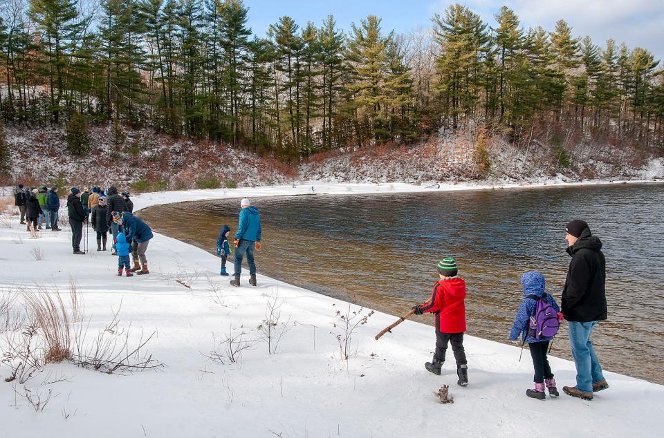 About 100 people hike to a spot on the Wachusett Reservoir in West Boylston during the annual First Day Hike Wednesday, Jan. 1, 2020.