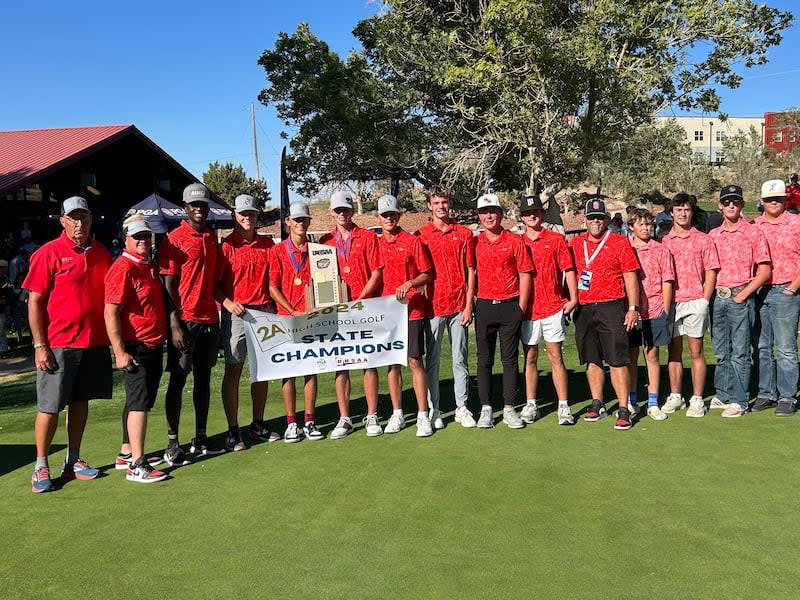 South Sevier players and coaches pose with championship trophy and banner at 2A boys golf state championship, Cedar Ridge Golf Course, Cedar City, Utah, Oct. 9, 2024.