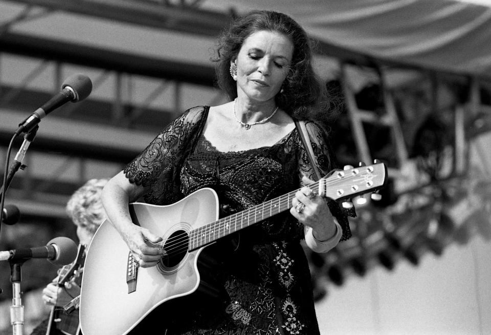 June Carter Cash performs as a member of the Carter Sisters on the PolyGram/Mercury Records show during Fan Fair at the Tennessee State Fairgrounds on June 9, 1987.