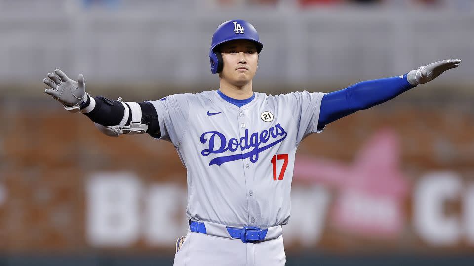 Ohtani reacts after hitting an RBI double during the fifth inning against the Atlanta Braves. - Todd Kirkland/Getty Images