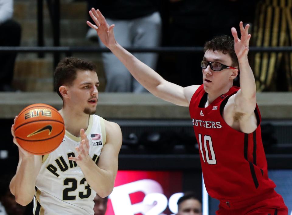 Purdue Boilermakers forward Camden Heide (23) is defended by Rutgers Scarlet Knights guard Gavin Griffiths (10) during the NCAA men’s basketball game, Thursday, Feb. 22, 2024, at Mackey Arena in West Lafayette, Ind.