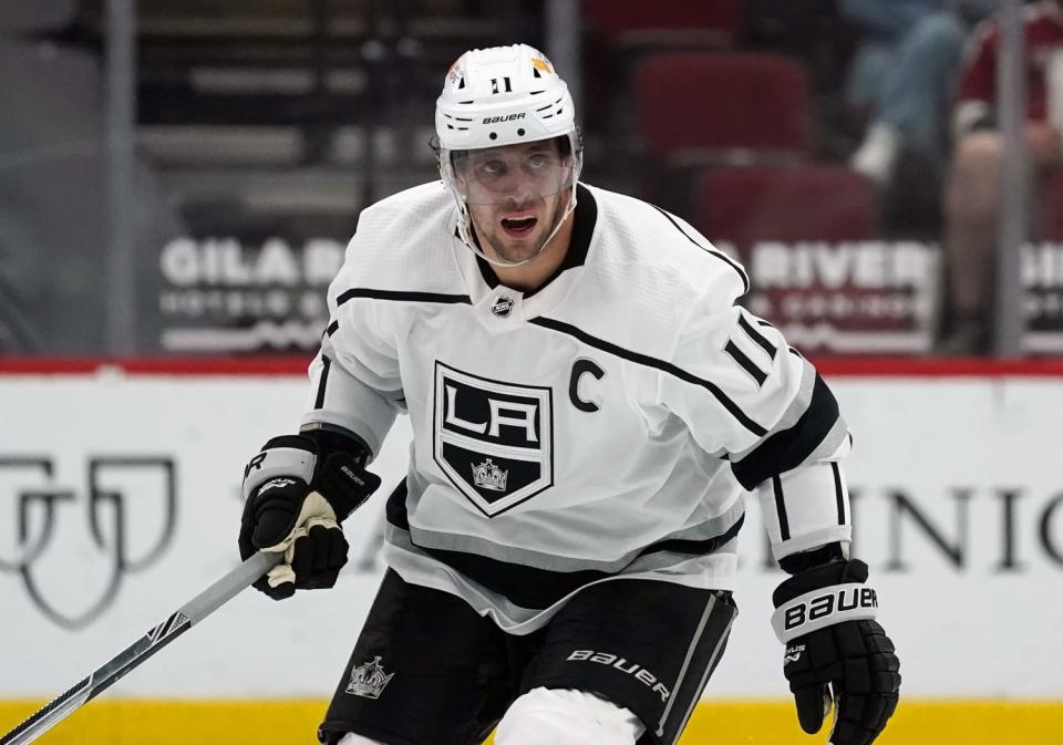 Kings center Anze Kopitar skates to the puck.