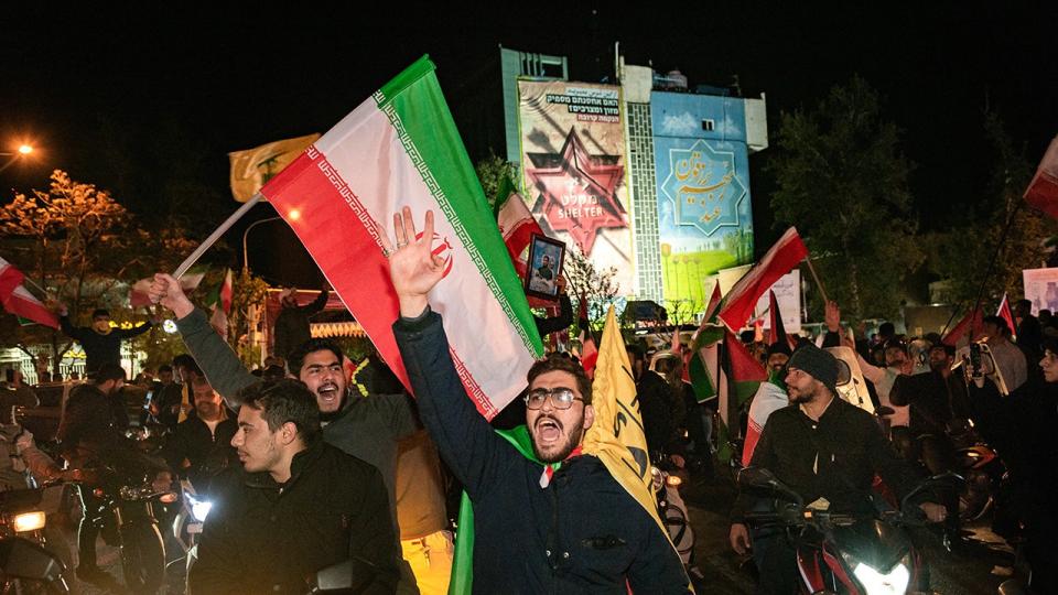 Iranian pro-government supporters shout anti-Israel slogans at Palestine Square in Tehran on April 14, 2024.