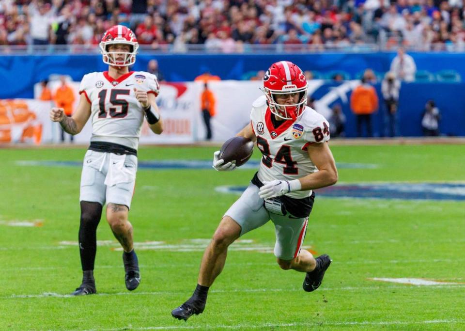 Georgia Bulldogs wide receiver Ladd McConkey (84) runs for a touchdown during the second half of the 90th annual Capital One Orange Bowl against the Florida State Seminoles at Hard Rock Stadium on Saturday, Dec. 30, 2023 in Miami Gardens, Fla.