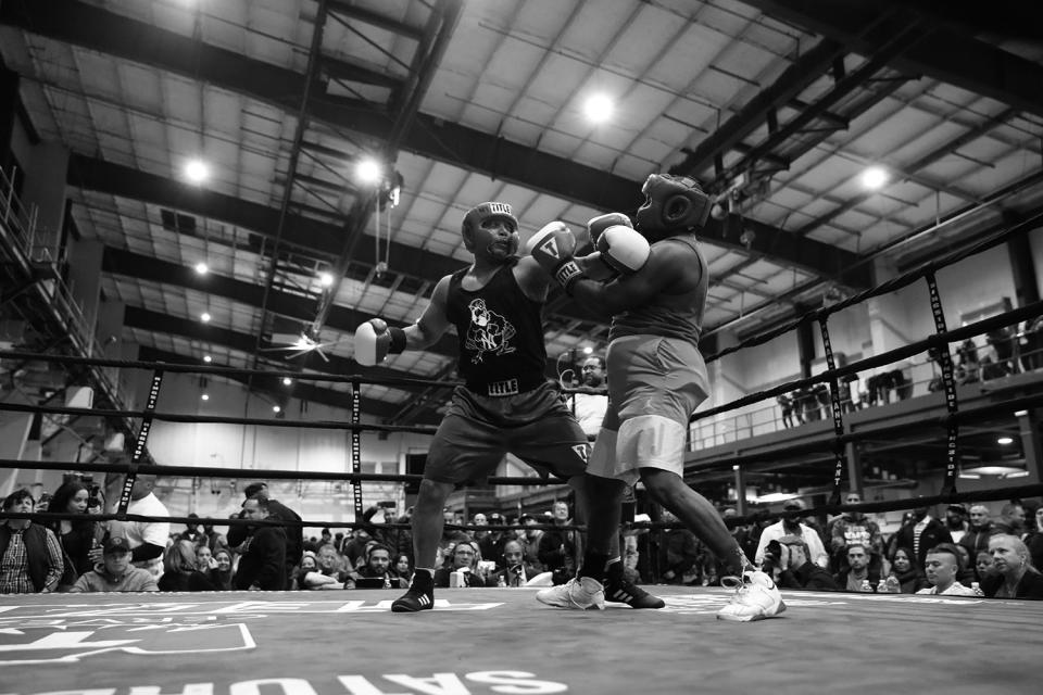 <p>Mark Evans reaches back to throw a punch against Makesi Oliver during the “Bronx Tough Turkey Tussle” in the Hunts Point section of the Bronx, New York, on Nov. 16, 2017. (Photo: Gordon Donovan/Yahoo News) </p>