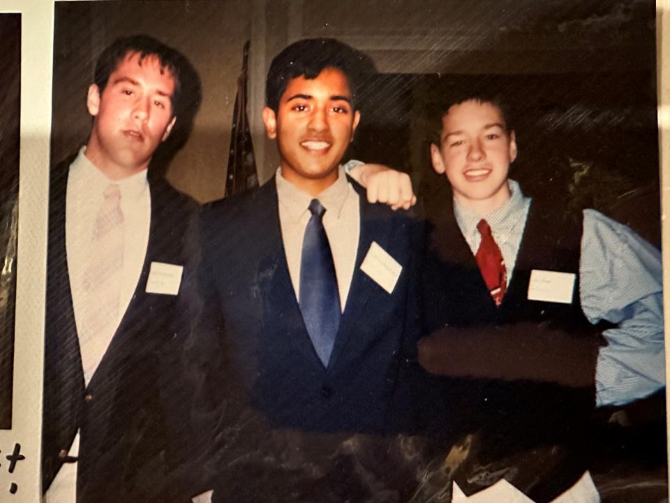 A photo of Vivek Ramaswamy, center, in high school with his friends Anson Frericks, left, and Chris Frericks, right.
