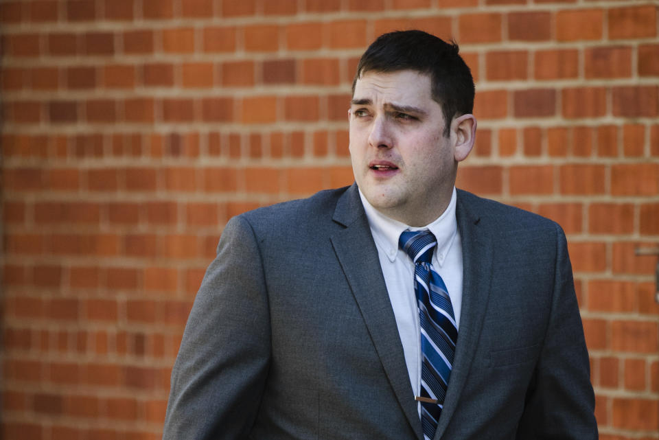 Former East Pittsburgh police officer Michael Rosfeld, charged with homicide in the shooting death of Antwon Rose II, walks to the Dauphin County Courthouse in Harrisburg, Pa., Tuesday, March 12, 2019. (AP Photo/Matt Rourke)