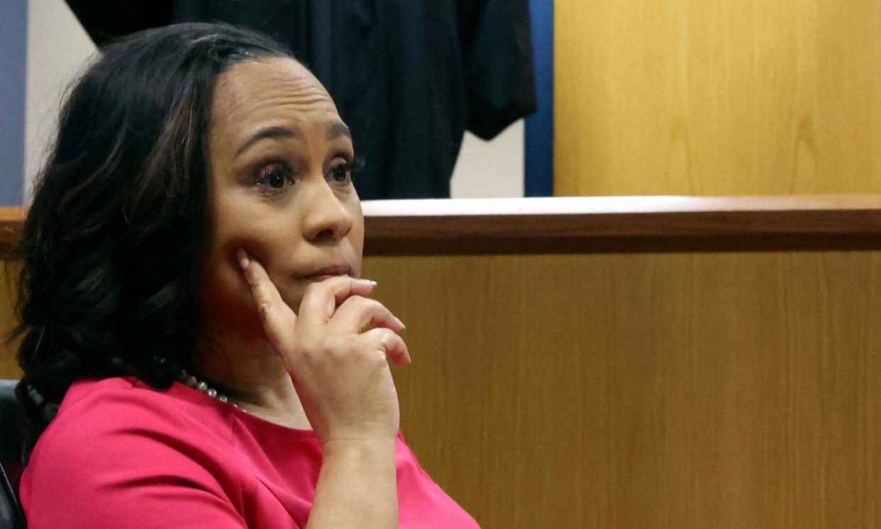 <span>Fani Willis sits in the stand at Fulton county superior court in Atlanta, Georgia, on Thursday.</span><span>Photograph: Alyssa Pointer/AP</span>