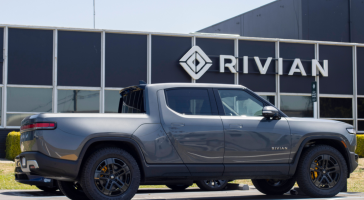 A new Rivian R1T truck is seen at a Rivian service center in South San Francisco, California. Rivian Automotive, (RIVN) is an electric vehicle automaker. RIVN stock price predictions