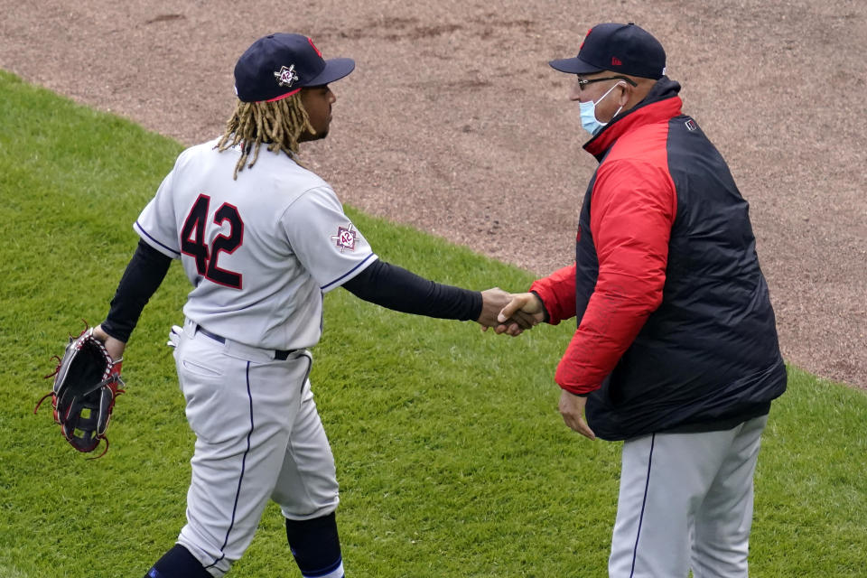 Cleveland Indians' Jose Ramirez, left, celebrates with manager Terry Francona after the Cleveland Indians defeated the Chicago White Sox 4-2 in a baseball game in Chicago, Thursday, April 15, 2021. (AP Photo/Nam Y. Huh)