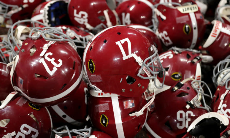 A detailed view of Alabama Crimson Tide helmets in a pile during the celebration after the CFP National Championship.