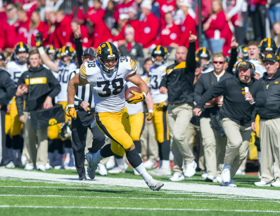 Iowa tight end T.J. Hockenson runs the ball up the sideline against Indiana. (AP Photo)