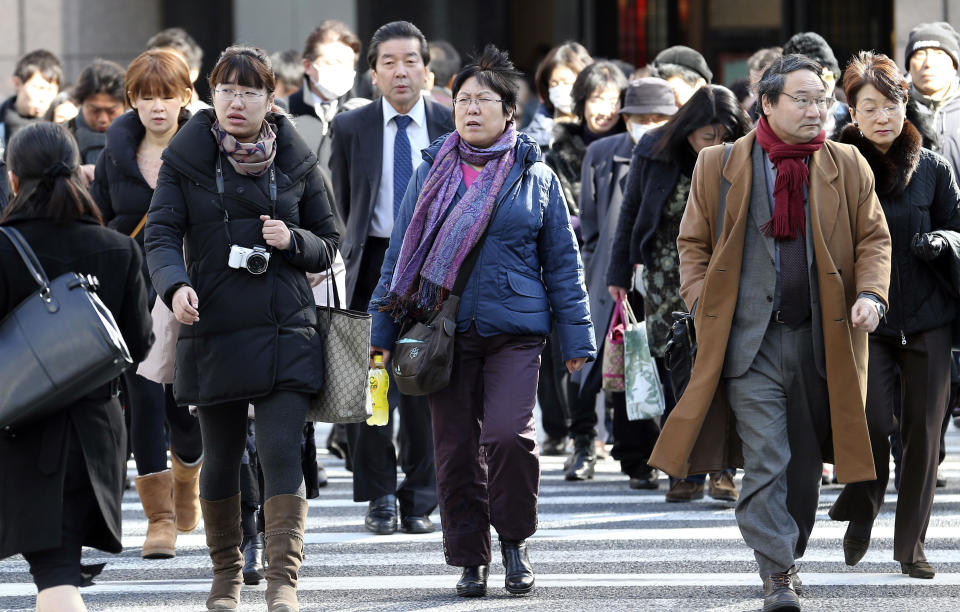 In this Jan. 17, 2014 photo, people walk through Ginza shipping district in Tokyo. Japan's consumer price index rose 0.4 percent in 2013, the first increase in five years, in further evidence the recovery in the world's third-largest economy is gaining momentum. (AP Photo/Koji Sasahara)