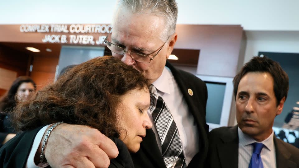Scot Peterson kisses his wife, Lydia Rodriguez, as he gives a media interview after being found not guilty on all charges. - Amy Beth Bennett/Pool/South Florida Sun-Sentinel/AP