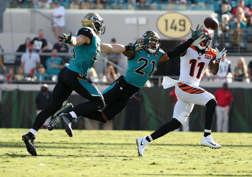 <p>Brandon LaFell #11 of the Cincinnati Bengals reaches for the football in front of Paul Posluszny and A.J. Bouye #21 of the Jacksonville Jaguars in the second half of their game at EverBank Field on November 5, 2017 in Jacksonville, Florida. (Photo by Logan Bowles/Getty Images) </p>