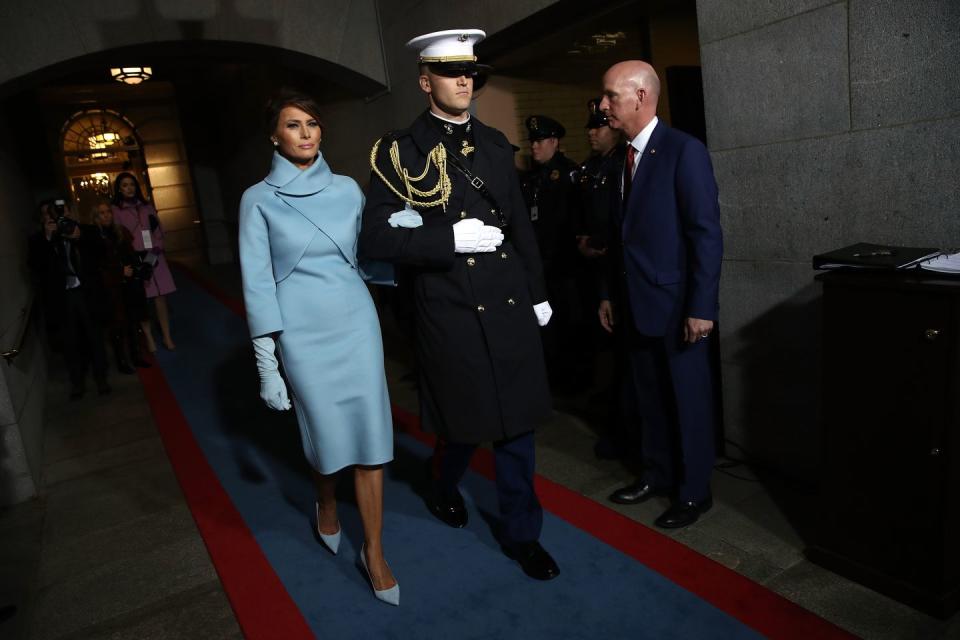 <p>This modern, wrapped, high neck look by Ralph Lauren was eye-catching and subtly patriotic at President Trump's inauguration in January 2017. Melania struck comparisons to fellow fashion icon Jackie Kennedy.</p>