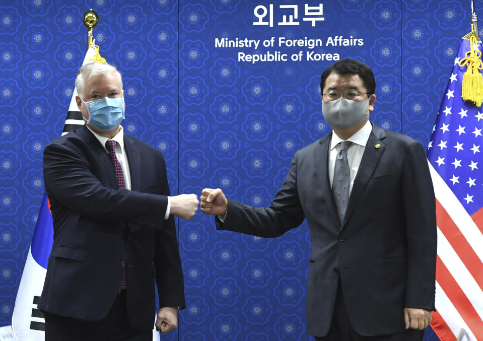 U.S. Deputy Secretary of State Stephen Biegun, left, and South Korean Vice Foreign Minister Choi Jong Kun pose for a photo prior to a meeting on North Korea and other issues at the Foreign Ministry in Seoul Wednesday, Dec. 9, 2020. (Korea Pool via AP)