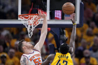 New York Knicks center Isaiah Hartenstein (55) tries to block a shot by Indiana Pacers forward Pascal Siakam during the first half of Game 6 in an NBA basketball second-round playoff series, Friday, May 17, 2024, in Indianapolis. (AP Photo/Michael Conroy)