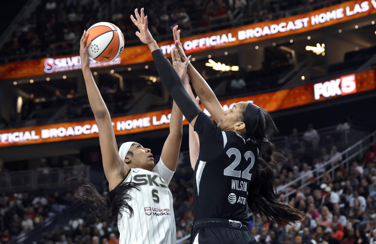 Chicago Sky forward Angel Reese (5) tries to shoot over Las Vegas Aces center A'ja Wilson (22) during the second half of an WNBA basketball game, Tuesday, Sept. 3, 2024, in Las Vegas. L (Steve Marcus/Las Vegas Sun via AP)