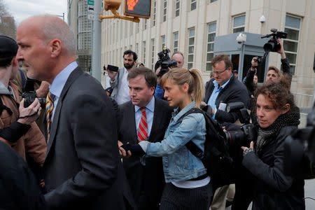 Actress Allison Mack, known for her role in the TV series "Smallville", departs after being granted bail following being charged with sex trafficking and conspiracy in New York, U.S., April 24, 2018. REUTERS/Lucas Jackson