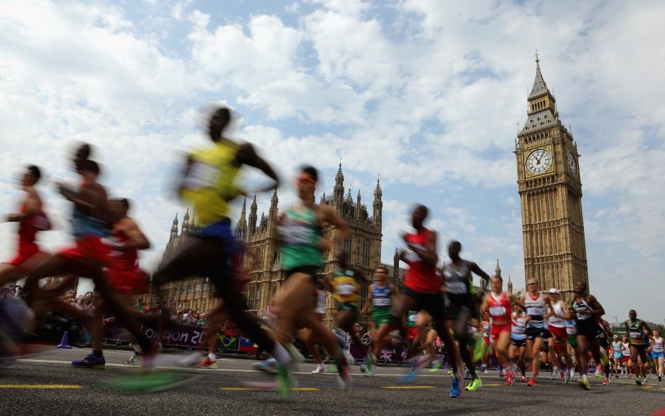 LONDON, ENGLAND - AUGUST 12: Athletes pass the Palace of Westminster as they compete in the Men's Marathon on Day 16 of the London 2012 Olympic Games on the streets of London on August 12, 2012 in London, England. (Photo by Ezra Shaw/Getty Images) - Getty Images Europe 