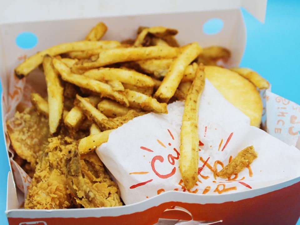 popeyes box with fried chicken cajun fries and biscuit