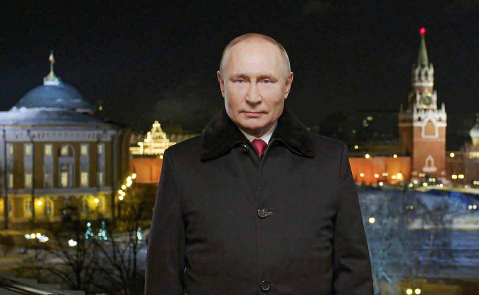 CORRECTS YEAR TO 2022 - In this photo released by Kremlin Press service on Saturday, Jan. 1, 2022, Russian President Vladimir Putin speaks during a recording of his annual televised New Year's message on New Year's eve in the Kremlin in Moscow, Russia. Russian President Vladimir Putin on Friday wished Russians positive changes in the new year, hailing their solidarity and strength in the face of tough challenges like the coronavirus pandemic. President Vladimir Putin is wishing Russians a happier new year, hailing their solidarity and strength in the face of tough challenges like the coronavirus pandemic. In a televised address broadcast just before midnight in each of Russia's 11 time zones, Putin said the nation has faced "colossal challenges but has learned to live in those harsh conditions and solve difficult tasks thanks to our solidarity." Putin's address to the nation on Friday was broadcast hours after his phone call with U.S. President Joe Biden, which focused on next month's talks to discuss Moscow's demand for Western security guarantees amid a Russian troop buildup near Ukraine.(Kremlin Pool Photo via AP)
