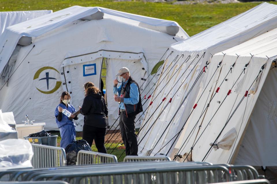 Medical personnel work at the Samaritan's Purse field hospital in New York's Central Park, Wednesday, April 1, 2020.