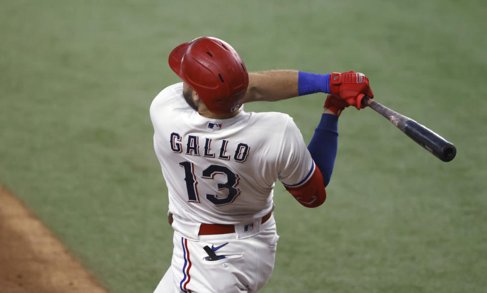 ARLINGTON, TX - JUNE 26: Joey Gallo #13 of the Texas Rangers hits a three-run home run against the Kansas City Royals during the fourth inning at Globe Life Field on June 26, 2021 in Arlington, Texas.(Photo by Ron Jenkins/Getty Images)