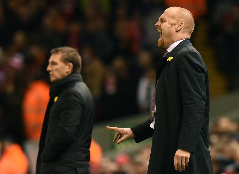 Liverpool's manager Brendan Rodgers (L) and Burnley's manager Sean Dyche watch their teams play, at Anfield in Liverpool, north-west England, on March 4, 2015