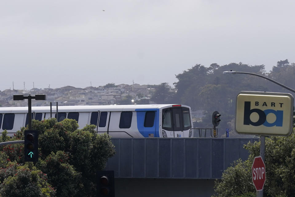 A BART train approaches a station in Daly City, Calif., Monday, June 5, 2023. California's public transit agencies say they are running out of money, plagued by depleted ridership from the pandemic and soon-to-expire federal aid. But California's state government is having its own financial problems, leaving the fate of public transit agencies uncertain in this car-obsessed state. (AP Photo/Jeff Chiu)