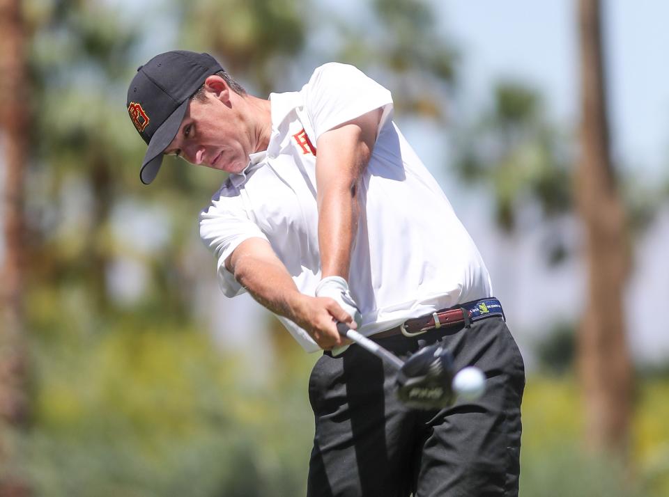 Lucas Myers of Palm Desert High School tees off on the 8th hole at the Indian Canyons Golf Resort's North Course during the Desert Empire League boys individual golf finals in Palm Springs, Calif., May 4, 2022.