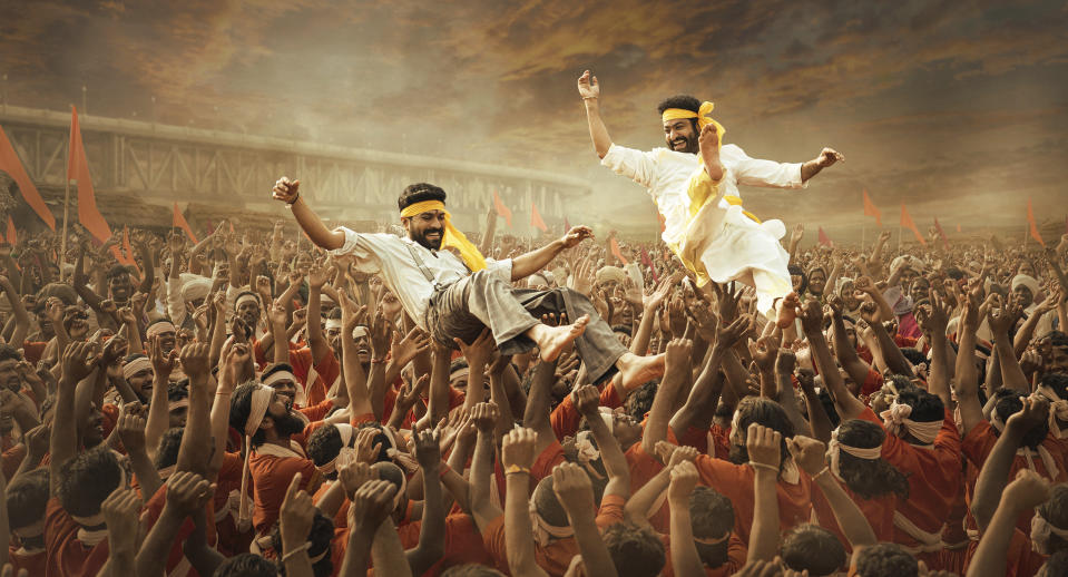 This image released by Netflix shows Ram Charan and N.T. Rama Rao Jr. in a scene from "RRR." (Netflix via AP)