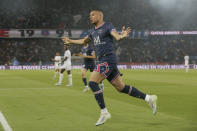 PSG's Kylian Mbappe reacts after scoring a goal during the French League One soccer match between Paris Saint Germain and Metz at the Parc des Princes stadium in Paris, France, Saturday, May 21, 2022. (AP Photo/Michel Spingler)