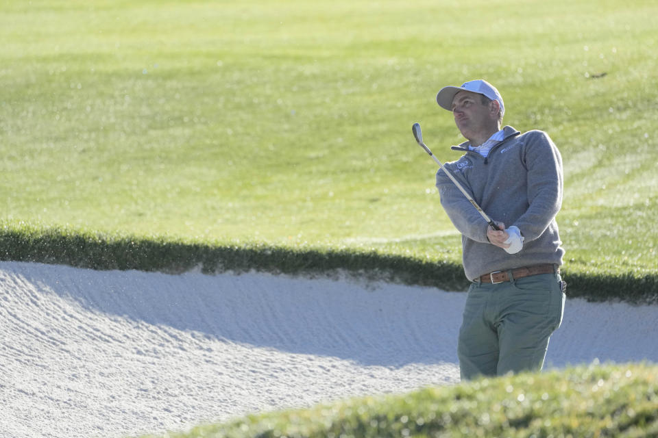 Brendon Todd follows his shot out of a bunker onto the 15th green of the Pebble Beach Golf Links during the fourth round of the AT&T Pebble Beach Pro-Am golf tournament in Pebble Beach, Calif., Monday, Feb. 6, 2023. (AP Photo/Godofredo A. Vásquez)