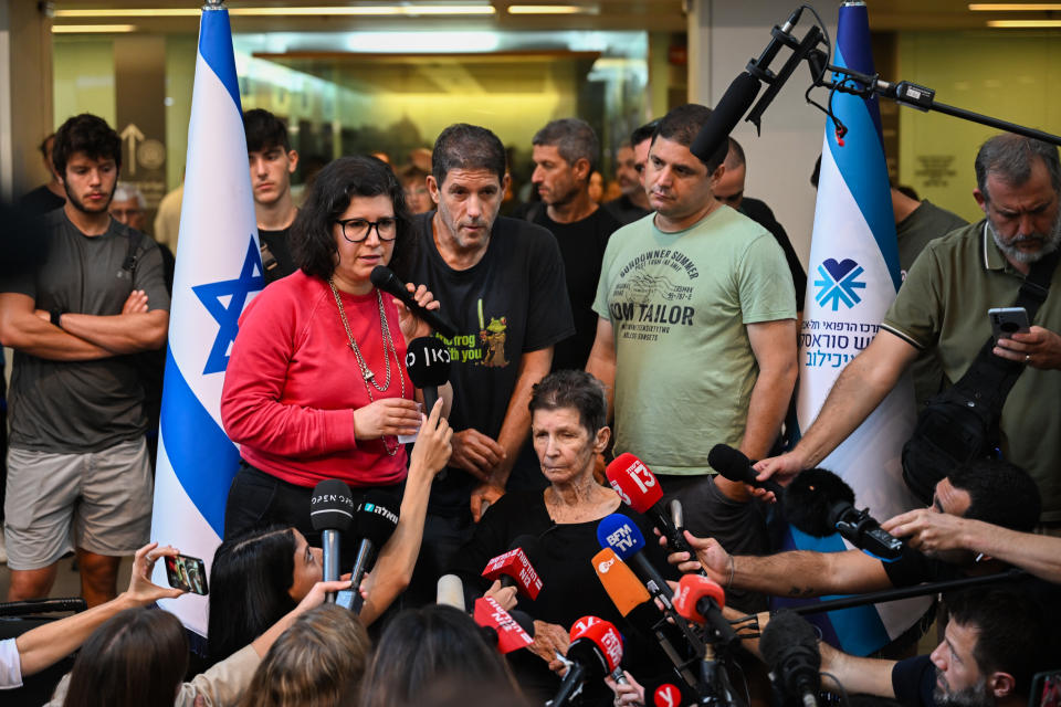 TEL AVIV, ISRAEL - OCTOBER 24: Sharone Lifschitz (L) speaks to the media alongside her brothers and mother, Yocheved Lifshitz (C) at Ichilov Hospital after her mother was released by Hamas last night, on October 24, 2023 in Tel Aviv, Israel. Last night, two hostages taken by Hamas on October 7th, Nurit Cooper and Yocheved Lifshitz, were released to the Red Cross within Gaza and returned to Israel. This followed the release of two other hostages, both US nationals, who were released on Saturday. (Photo by Alexi J. Rosenfeld/Getty Images)