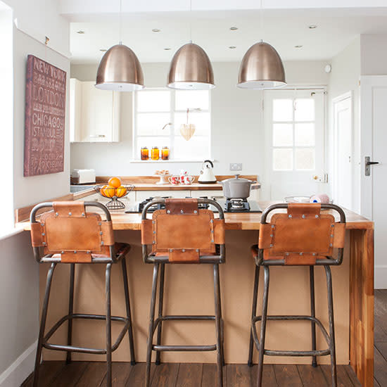 Mix up vintage and industrial finishes in a modern kitchen