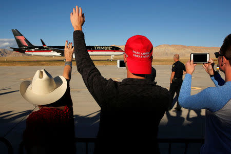 People wave as Republican presidential nominee Donald Trump departs after a campaign rally in a airplane hangar in Grand Junction, Colorado, U.S. October 18, 2016. REUTERS/Jonathan Ernst