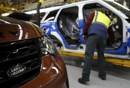 A worker looks inside a vehicle destined for China at the Jaguar Land Rover facility in Solihull, Britain, January 30, 2017. REUTERS/Darren Staples