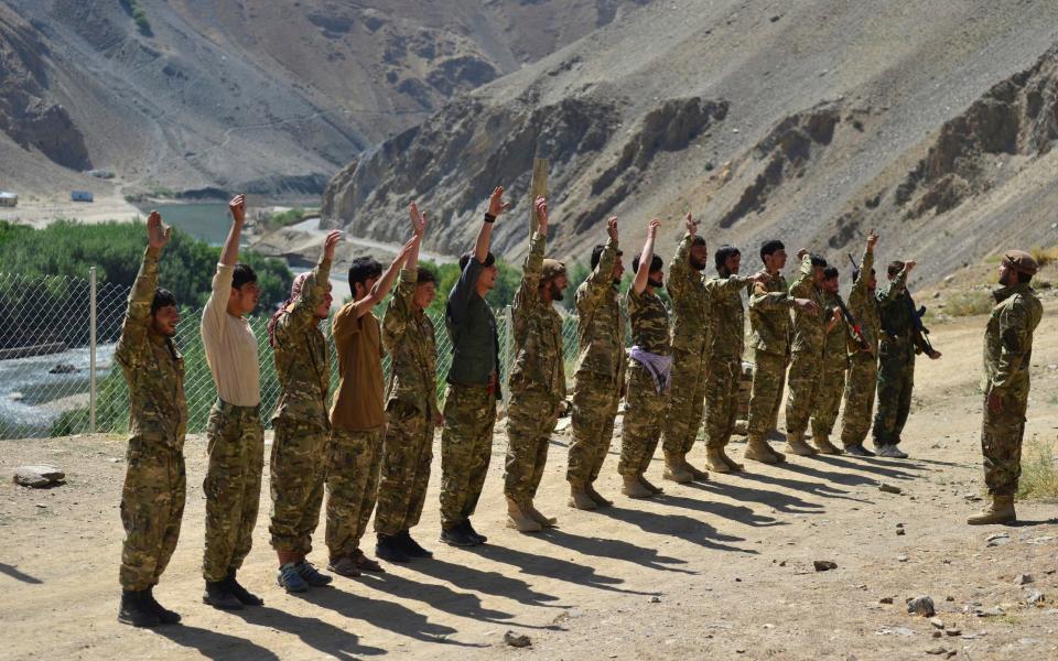 Militiamen loyal to Ahmad Massoud, son of the late Ahmad Shah Massoud, take part in a training exercise - AP