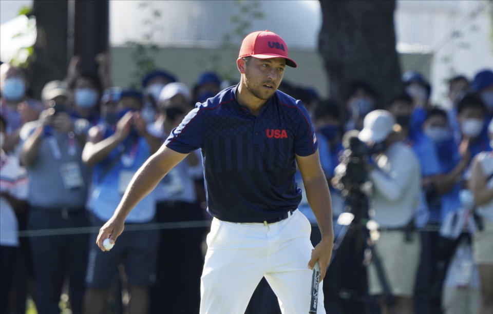 CORRECTS LAST NAME TO SCHAUFFELE FROM SHAUFFELE - Xander Schauffele of the United States celebrates winning gold in the men's golf event at the 2020 Summer Olympics on Sunday, Aug. 1, 2021, in Kawagoe, Japan. (AP Photo/Andy Wong)