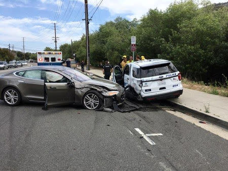 A Tesla sedan is shown after it struck a parked Laguna Beach Police Department vehicle in Laguna Beach, California, U.S. in this May 29, 2018 handout photo. Laguna Beach Police Department/Handout via REUTERS