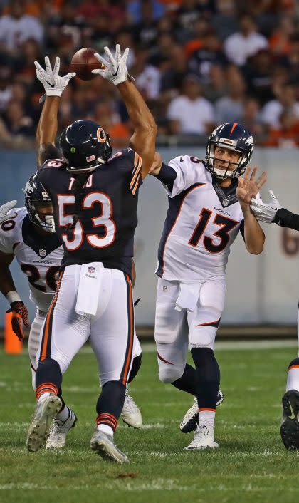 Denver Broncos quarterback Trevor Siemian, right, played well near his old stomping grounds on Thursday (Getty Images).