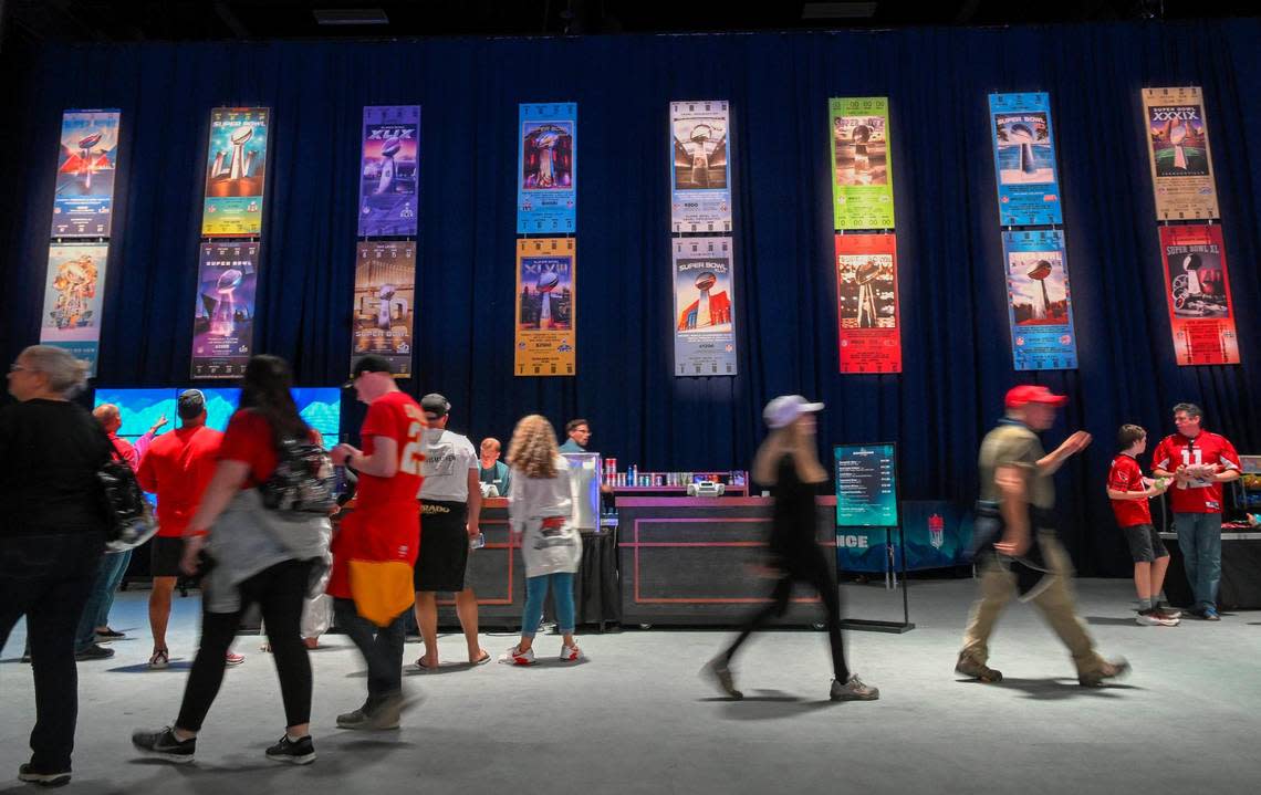 Football fans took in the NFL Super Bowl Experience which includes an oversized display of tickets to past Super Bowls on Friday, Feb. 10, 2023, at the Phoenix Convention Center.