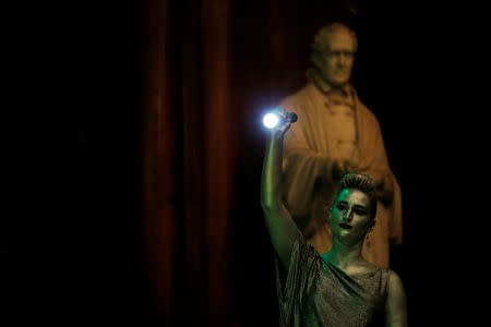 Human spotlight Katrina Rosenberg lights the stage during the 26th First Annual Ig Nobel Prize ceremony at Harvard University in Cambridge, Massachusetts, U.S. September 22, 2016. REUTERS/Brian Snyder