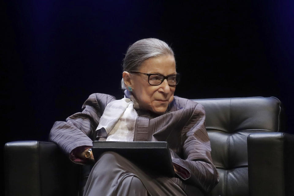 FILE - In this Oct. 21, 2019, file photo U.S. Supreme Court Justice Ruth Bader Ginsburg listens to speakers during the inaugural Herma Hill Kay Memorial Lecture at the University of California at Berkeley in Berkeley, Calif. At 87, Ginsburg is the oldest member of the court. Her next oldest colleagues are 81-year-old Stephen Breyer, 72-year-old Clarence Thomas and 70-year-old Samuel Alito. (AP Photo/Jeff Chiu, File)